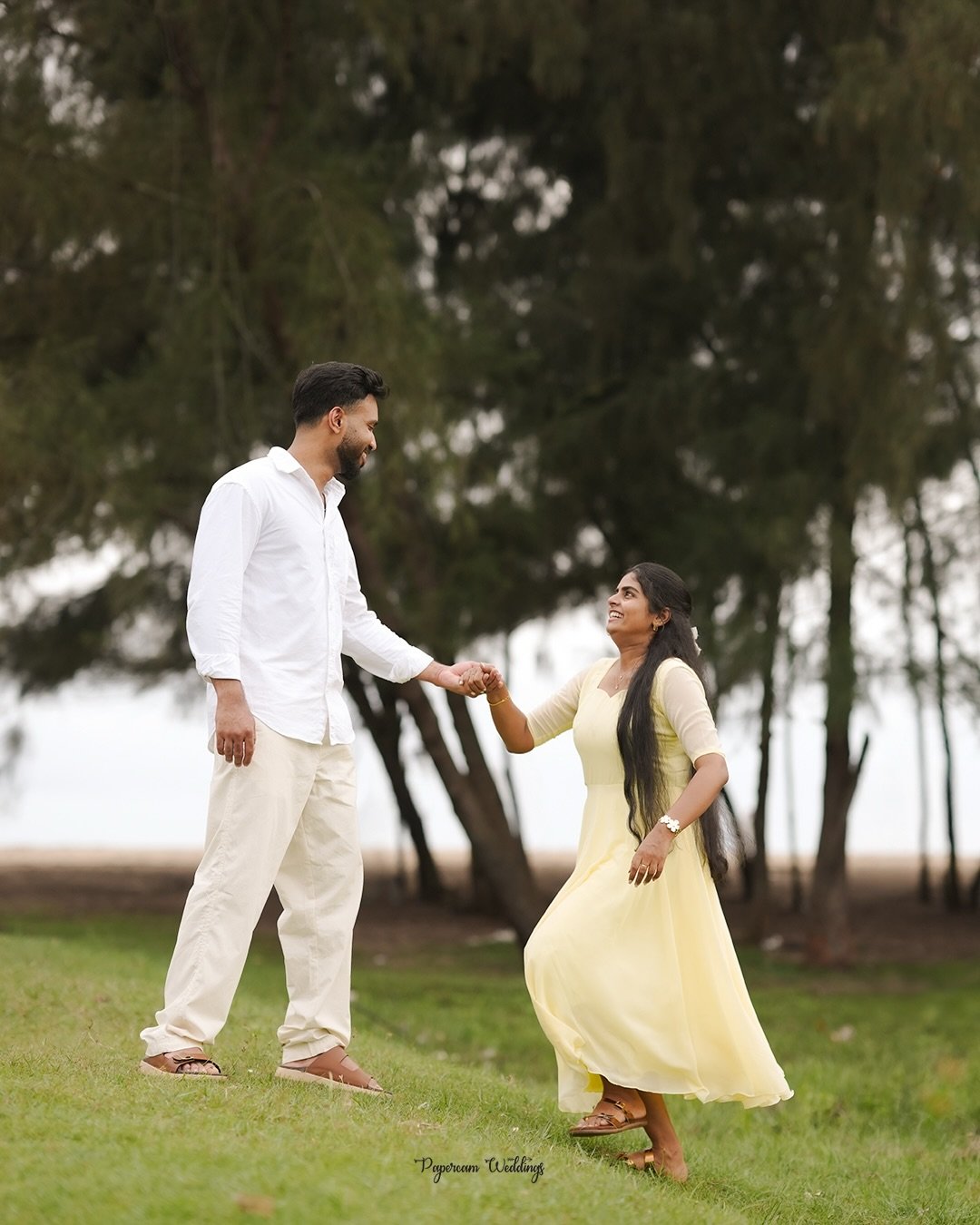A couple holding hands during an outdoor portrait session